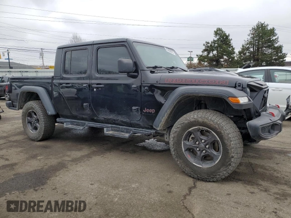 2023 Jeep Gladiator Rubicon with VIN 1C6JJTBG6PL500516, listed as a Copart auction lot 43432015 with 107,096 mi miles and Salvage title. Bid and sale history available at DreamBid. Image 4.