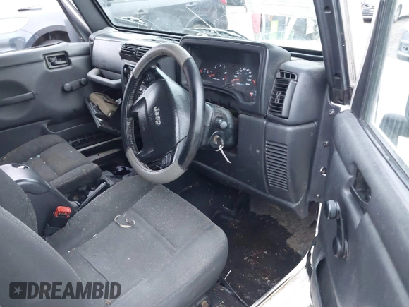 2006 Jeep Wrangler Sport Right Hand Drive with VIN 1J4F449S16P709895, listed as a IAAI auction lot 41349311 with 157,125 mi miles. Bid and sale history available at carsss.com. Image 5.