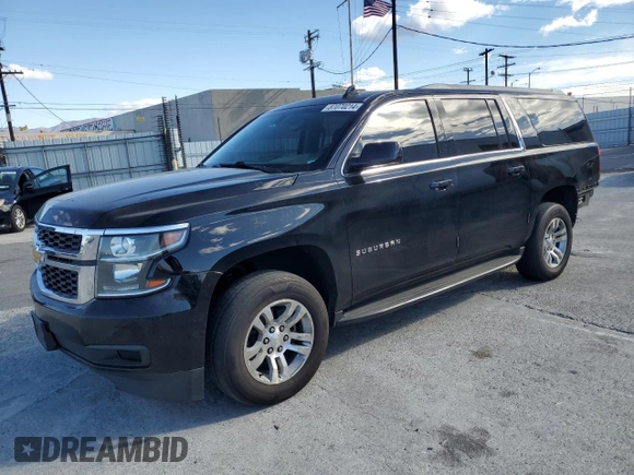 2017 Chevrolet Suburban LS with VIN 1GNSCGECXHR351539, listed as a Copart auction lot 87070214 with 246,129 mi miles and Salvage title. Bid and sale history available at DreamBid. Image 1.