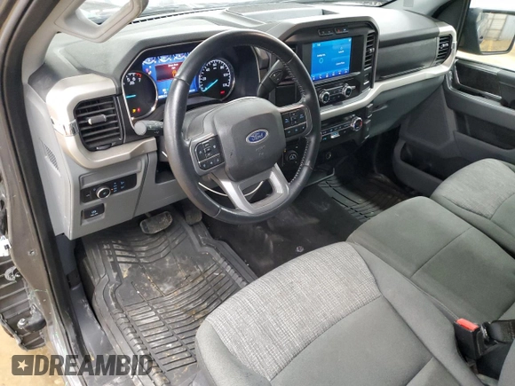 2021 Ford F-150 XL with VIN 1FTMF1EP7MKE58611, listed as a Copart auction lot 56912955 with 30,850 mi miles and Salvage title. Bid and sale history available at DreamBid. Image 8.