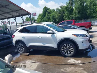2020 Ford Escape Titanium z VIN 1FMCU9J90LUA39747, wystawiony jako IAAI lot #42369890 z przebiegiem 31 425 mil mil oraz . Historia ofert i sprzedaży dostępna na DreamBid. Obrazek 13.