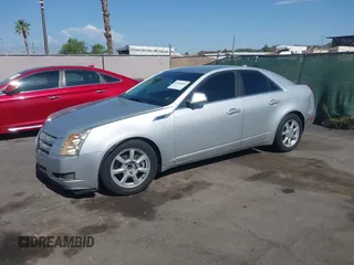 2009 Cadillac CTS RWD z VIN 1G6DU57VX90143820, wystawiony jako IAAI lot #42450086 z przebiegiem 170 656 mil mil oraz . Historia ofert i sprzedaży dostępna na DreamBid. Obrazek 2.