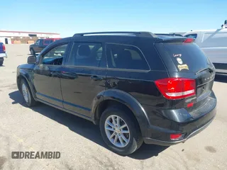 2016 Dodge Journey SXT with VIN 3C4PDDBG3GT215910, listed as a IAAI auction lot 41798779 with 165,505 mi miles. Bid and sale history available at carsss.com. Image 3.