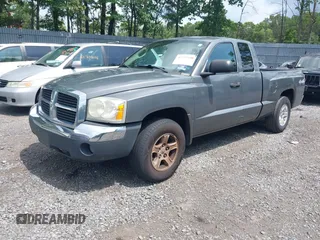 2005 Dodge Dakota SLT with VIN 1D7HW42N25S155393, listed as a IAAI auction lot 42727690 with 230,042 mi miles and . Bid and sale history available at DreamBid. Image 2.