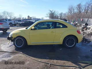 2012 Volkswagen Beetle 2.5L PZEV with VIN 3VWJP7AT9CM610530, listed as a IAAI auction lot 41388728 with 143,909 mi miles. Bid and sale history available at carsss.com. Image 14.