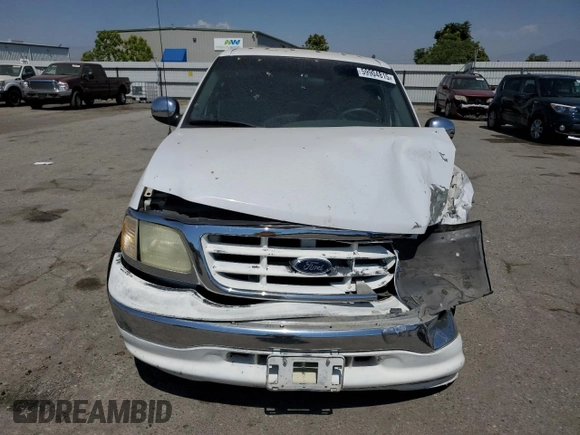 2001 Ford F-150 XLT with VIN 1FTRW07651KC49772, listed as a Copart auction lot 59904815 with 145,639 mi miles and Salvage title. Bid and sale history available at DreamBid. Image 5.