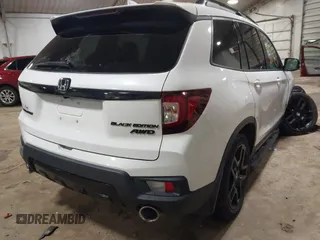 2024 Honda Passport Black Edition with VIN 5FNYF8H86RB001825, listed as a IAAI auction lot 41019497 with 15,884 mi miles and . Bid and sale history available at DreamBid. Image 4.