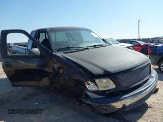 1999 Ford F-150 XL with VIN 1FTRX18L3XKA77743, listed as a IAAI auction lot 42512532 with Not provided miles and . Bid and sale history available at DreamBid. Image 1.