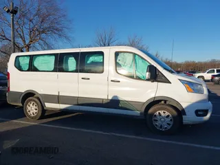 2021 Ford Transit Passenger XL with VIN 1FBAX2Y87MKA64167, listed as a IAAI auction lot 41087474 with 67,242 mi miles and . Bid and sale history available at DreamBid. Image 13.