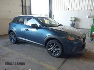 2018 Mazda CX-3 Touring with VIN JM1DKFC78J1323439, listed as a IAAI auction lot 41725784 with 134,055 mi miles. Bid and sale history available at carsss.com. Image 1.