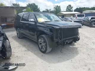 2015 Chevrolet Suburban LTZ z VIN 1GNSCKKC3FR659964, wystawiony jako IAAI lot #42585514 z przebiegiem 126 190 mil mil oraz . Historia ofert i sprzedaży dostępna na DreamBid. Obrazek 1.