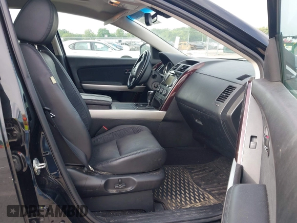 2015 Mazda CX-9 Grand Touring z VIN JM3TB2DA1F0456773, wystawiony jako IAAI lot #42257555 z przebiegiem 152 890 mil mil oraz . Historia ofert i sprzedaży dostępna na DreamBid. Obrazek 5.