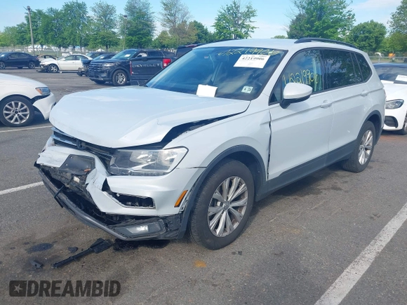 2018 Volkswagen Tiguan S with VIN 3VV0B7AX5JM025815, listed as a IAAI auction lot 42219906 with 168,122 mi miles and . Bid and sale history available at DreamBid. Image 2.