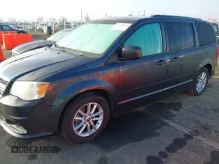 2014 Dodge Grand Caravan SXT with VIN 2C4RDGCG2ER267358, listed as a IAAI auction lot 41001692 with 186,763 mi miles and . Bid and sale history available at DreamBid. Image 2.