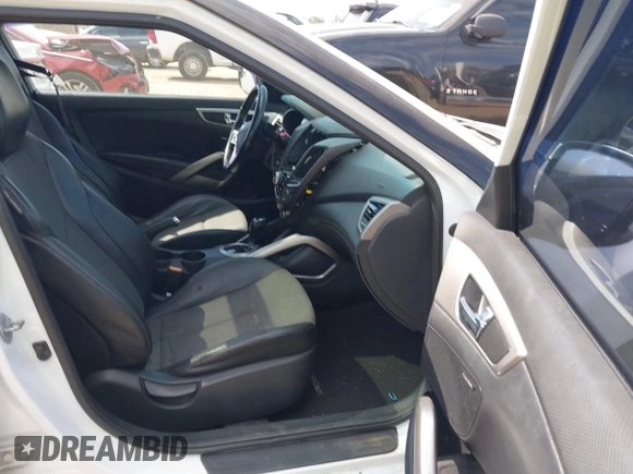 2014 Hyundai Veloster with VIN KMHTC6AD1EU217707, listed as a IAAI auction lot 41718176 with 191,306 mi miles. Bid and sale history available at carsss.com. Image 5.