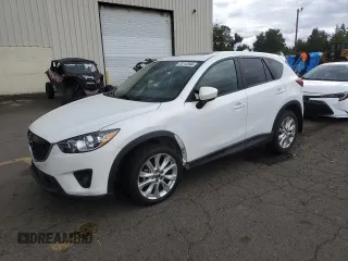 2014 Mazda CX-5 Grand Touring with VIN JM3KE4DY2E0354795, listed as a Copart auction lot 70713544 with 58,848 mi miles and Salvage Title. Bid and sale history available at DreamBid. Image 1.