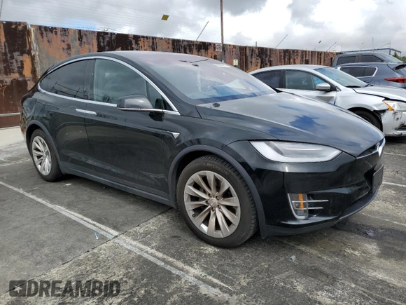 2018 Tesla Model X 75D with VIN 5YJXCBE24JF130216, listed as a Copart auction lot 48894215 with 75,694 mi miles and Salvage Title. Bid and sale history available at carsss.com. Image 4.