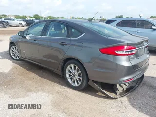 2017 Ford Fusion Hybrid SE with VIN 3FA6P0LU5HR336779, listed as a IAAI auction lot 42691789 with 140,720 mi miles and . Bid and sale history available at DreamBid. Image 3.