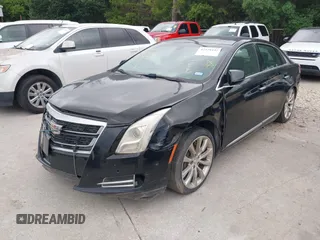2017 Cadillac XTS Luxury z VIN 2G61M5S32H9158776, wystawiony jako IAAI lot #42528442 z przebiegiem 90 680 mil mil oraz . Historia ofert i sprzedaży dostępna na DreamBid. Obrazek 2.