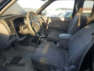 1999 Nissan Frontier XE with VIN 1N6ED26Y4XC322021, listed as a Copart auction lot 82690214 with 102,758 mi miles and Clean title. Bid and sale history available at DreamBid. Image 7.