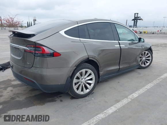 2016 Tesla Model X 70D with VIN 5YJXCBE22GF017499, listed as a IAAI auction lot 42192962 with 103,430 mi miles and . Bid and sale history available at DreamBid. Image 4.