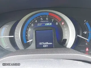 2010 Honda Insight EX with VIN JHMZE2H7XAS024879, listed as a IAAI auction lot 42029553 with 187,648 mi miles. Bid and sale history available at carsss.com. Image 7.