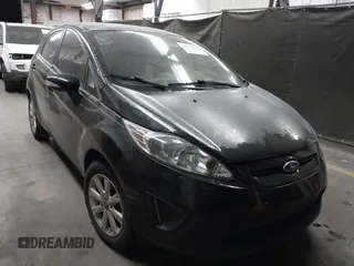 2013 Ford Fiesta SE with VIN 3FADP4EJ1DM107945, listed as a IAAI auction lot 42025064 with Not Provided miles. Bid and sale history available at carsss.com. Image 1.