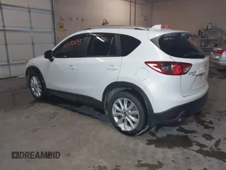 2013 Mazda CX-5 Grand Touring with VIN JM3KE4DE8D0147851, listed as a IAAI auction lot 41570695 with 94,648 mi miles. Bid and sale history available at carsss.com. Image 3.
