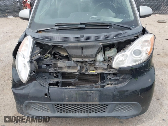 2013 Smart fortwo Pure with VIN WMEEJ3BA5DK620493, listed as a IAAI auction lot 42071086 with 85,883 mi miles and . Bid and sale history available at DreamBid. Image 6.