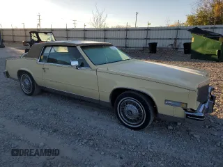 1985 Cadillac Eldorado z VIN 1G6EL5781FE647818, wystawiony jako Copart lot #77608224 z przebiegiem 7192 mil mil oraz Tytuł czysty. Historia ofert i sprzedaży dostępna na DreamBid. Obrazek 4.