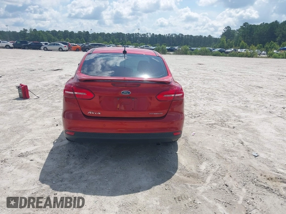 2018 Ford Focus Titanium z VIN 1FADP3J23JL295888, wystawiony jako IAAI lot #42524088 z przebiegiem 108 812 mil mil oraz . Historia ofert i sprzedaży dostępna na DreamBid. Obrazek 16.