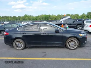 2016 Ford Fusion Titanium with VIN 3FA6P0K90GR179528, listed as a IAAI auction lot 42181213 with 230,264 mi miles. Bid and sale history available at carsss.com. Image 13.