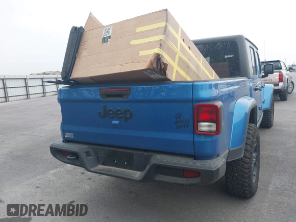 2023 Jeep Gladiator Sport S z VIN 1C6HJTAG6PL579136, wystawiony jako IAAI lot #41946641 z przebiegiem 14 856 mil mil oraz . Historia ofert i sprzedaży dostępna na DreamBid. Obrazek 16.