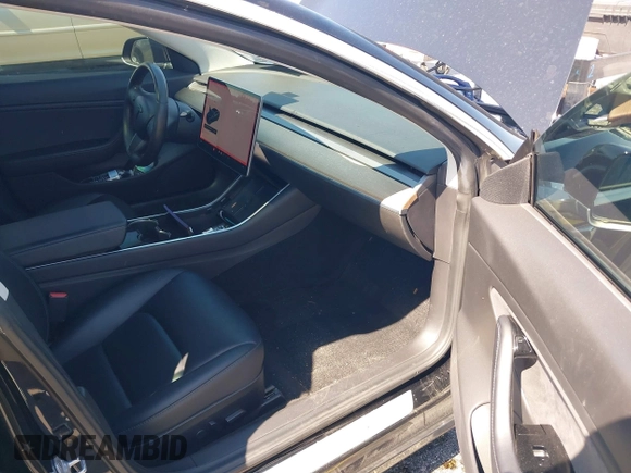 2019 Tesla Model 3 Mid Range with VIN 5YJ3E1EA0KF317058, listed as a IAAI auction lot 42025195 with 108,771 mi miles. Bid and sale history available at carsss.com. Image 5.
