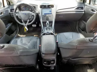 2014 Ford Fusion Titanium Hybrid with VIN 3FA6P0RU2ER158302, listed as a Copart auction lot 59049995 with 108,571 mi miles and Salvage title. Bid and sale history available at DreamBid. Image 8.