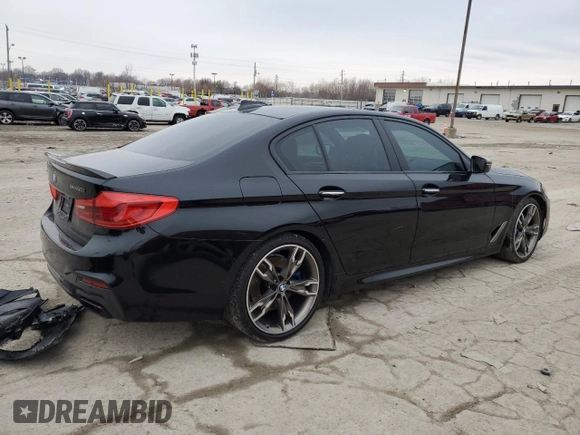 2018 BMW 5 Series M550i xDrive with VIN WBAJB9C56JB049524, listed as a Copart auction lot 43511805 with 55,759 mi miles and Salvage title. Bid and sale history available at DreamBid. Image 3.