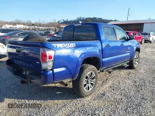 2023 Toyota Tacoma 4WD SR with VIN 3TYCZ5AN1PT119133, listed as a IAAI auction lot 41574906 with 19,887 mi miles. Bid and sale history available at carsss.com. Image 4.