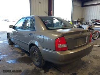 2000 Mazda Protege DX with VIN JM1BJ2225Y0278677, listed as a IAAI auction lot 42056816 with 188,552 mi miles. Bid and sale history available at carsss.com. Image 3.