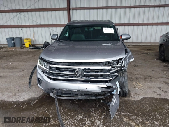 2023 Volkswagen Atlas SE z VIN 1V2HE2CA0PC222291, wystawiony jako IAAI lot #42431536 z przebiegiem 23 114 mil mil oraz . Historia ofert i sprzedaży dostępna na DreamBid. Obrazek 13.