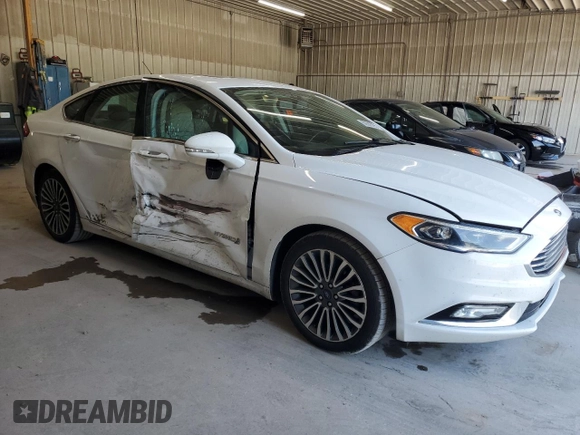 2017 Ford Fusion Hybrid Titanium z VIN 3FA6P0RU3HR400034, wystawiony jako Copart lot #62689795 z przebiegiem 109 118 mil mil oraz Szkoda całkowita • Salvage title. Historia ofert i sprzedaży dostępna na DreamBid. Obrazek 4.