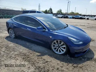 2020 Tesla Model 3 Long Range with VIN 5YJ3E1EB4LF744575, listed as a Copart auction lot 50202375 with 61,357 mi miles and Salvage Title. Bid and sale history available at carsss.com. Image 4.