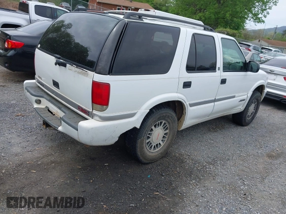 1999 GMC Jimmy SLE with VIN 1GKDT13WXX2521082, listed as a IAAI auction lot 42079903 with 160,055 mi miles. Bid and sale history available at carsss.com. Image 4.
