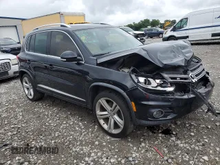 2014 Volkswagen Tiguan SEL with VIN WVGAV3AX7EW101796, listed as a Copart auction lot 60904345 with 97,652 mi miles and Salvage title. Bid and sale history available at DreamBid. Image 4.