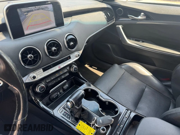2018 Kia Stinger with VIN KNAE15LA7J6031245, listed as a Copart auction lot 55879285 with 144,020 mi miles and Clean Title. Bid and sale history available at carsss.com. Image 9.