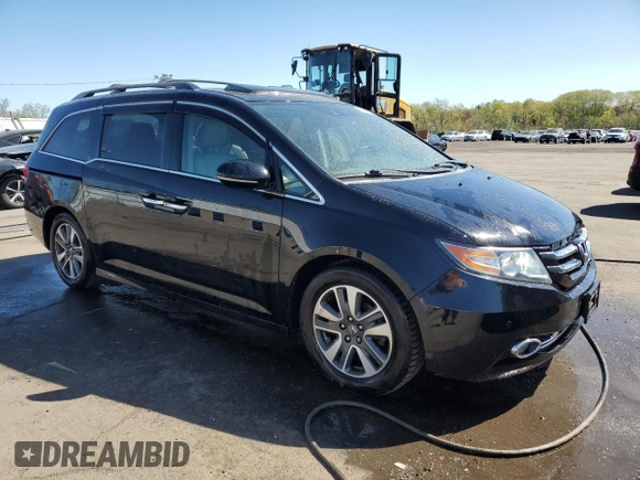 2014 Honda Odyssey Touring with VIN 5FNRL5H99EB088859, listed as a Copart auction lot 54828555 with 147,147 mi miles and Salvage Title. Bid and sale history available at DreamBid. Image 4.