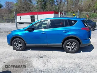 2018 Toyota RAV4 LE with VIN JTMZFREV4JJ734702, listed as a IAAI auction lot 41987540 with 141,526 mi miles. Bid and sale history available at carsss.com. Image 14.