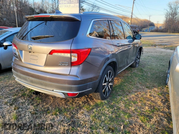 2020 Honda Pilot Touring 8-Passenger with VIN 5FNYF6H93LB022913, listed as a Copart auction lot 50825655 with 10,513 mi miles and Salvage Title. Bid and sale history available at DreamBid. Image 4.