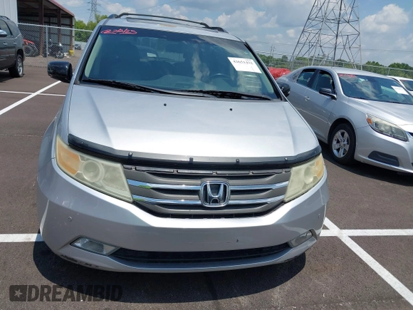 2011 Honda Odyssey Touring with VIN 5FNRL5H99BB058448, listed as a IAAI auction lot 42651432 with 208,581 mi miles and . Bid and sale history available at DreamBid. Image 12.