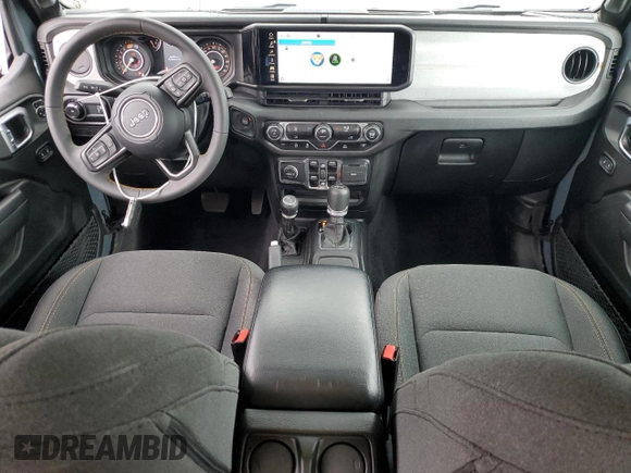 2024 Jeep Wrangler Sport S with VIN 1C4PJXDN4RW124924, listed as a Copart auction lot 50516555 with 7,747 mi miles and Salvage Title. Bid and sale history available at DreamBid. Image 8.