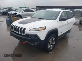 2015 Jeep Cherokee Trailhawk with VIN 1C4PJMBB1FW630519, listed as a IAAI auction lot 41605466 with 219,390 mi miles and . Bid and sale history available at carsss.com. Image 18.